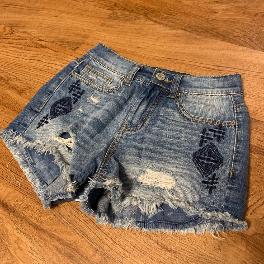 Mid Rise Distressed Denim Shorts